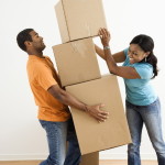 Couple with moving boxes.